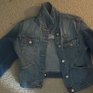 Denim jacket with butterfly pin
